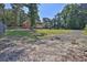 Exterior of the home showing a large, manicured backyard with mature trees at 3765 Cannonwolde Dr, Snellville, GA 30039