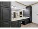 Large bathroom with double vanity, dark cabinetry, and tile flooring at 3765 Cannonwolde Dr, Snellville, GA 30039
