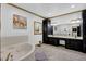 Bathroom features double sinks, framed mirrors, and a jacuzzi tub at 3765 Cannonwolde Dr, Snellville, GA 30039