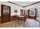 Bright dining area with tile floors, a wood table, and a view of the outdoors at 3765 Cannonwolde Dr, Snellville, GA 30039