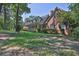 Beautiful brick home featuring a front porch and lush greenery at 3765 Cannonwolde Dr, Snellville, GA 30039