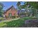 Brick home with meticulous landscaping and a charming covered porch at 3765 Cannonwolde Dr, Snellville, GA 30039