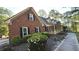Beautiful brick home with black shutters and lovely landscaping, plus an inviting covered front porch at 3765 Cannonwolde Dr, Snellville, GA 30039