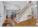 Inviting foyer with hardwood floors and staircase leading to the second floor at 3765 Cannonwolde Dr, Snellville, GA 30039