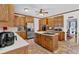 Spacious kitchen featuring wooden cabinets, stainless steel appliances, and tile flooring at 3765 Cannonwolde Dr, Snellville, GA 30039