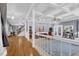 Spacious living room with coffered ceilings, hardwood floors, and elegant columns at 3765 Cannonwolde Dr, Snellville, GA 30039