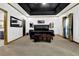 Spacious bedroom with black coffered ceiling, large bed, and hardwood trim at 3765 Cannonwolde Dr, Snellville, GA 30039