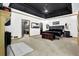 This large bedroom has a black coffered ceiling, ensuite, and a decorative chest at 3765 Cannonwolde Dr, Snellville, GA 30039
