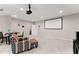 Finished basement is set up as a media room with a projector, screen, and comfortable seating at 4022 Roberts Crest Dr, Suwanee, GA 30024