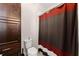 Bathroom shows a toilet, storage cabinet and shower with decorative curtain at 4022 Roberts Crest Dr, Suwanee, GA 30024