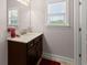 Bathroom features a modern vanity with solid surface countertop and decorative accents at 4022 Roberts Crest Dr, Suwanee, GA 30024