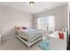 This bedroom features a bed, a window letting in natural light, and cat shelves on the wall at 4022 Roberts Crest Dr, Suwanee, GA 30024