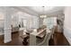 Dining room with hardwood floors, stylish furnishings, and ample natural light at 4022 Roberts Crest Dr, Suwanee, GA 30024