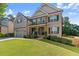 Beautiful home with an attached garage and meticulously maintained landscaping at 4022 Roberts Crest Dr, Suwanee, GA 30024