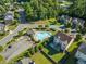 Aerial view of the community pool surrounded by lounge chairs and landscaping at 4022 Roberts Crest Dr, Suwanee, GA 30024