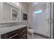Elegant bathroom featuring a marble-top vanity and glass-enclosed shower with white subway tile at 00 Memory Ln, Canton, GA 30115