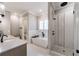 Bright bathroom showcasing a freestanding tub, tiled shower with mosaic details, and modern fixtures at 00 Memory Ln, Canton, GA 30115