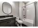 Classic bathroom with tile floors, and a shower and tub with white subway tiles and a dark vanity at 00 Memory Ln, Canton, GA 30115