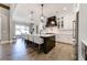 Gourmet kitchen with a large island, stainless steel appliances, white cabinets, and adjacent dining area at 00 Memory Ln, Canton, GA 30115
