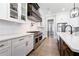 Beautiful kitchen with stainless steel appliances, white countertops, and custom cabinets for ample storage at 00 Memory Ln, Canton, GA 30115