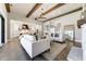 Elegant living room showcasing an open floor plan, fireplace, hardwood floors, and view into the kitchen at 00 Memory Ln, Canton, GA 30115