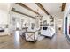 Spacious open-concept living room with hardwood floors, fireplace, and view of the entry and dining area at 00 Memory Ln, Canton, GA 30115