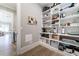 Walk-in pantry with built-in shelving and easy access to the kitchen and dining area at 00 Memory Ln, Canton, GA 30115