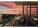 Charming balcony with city views at sunset, furnished with comfortable seating, perfect for relaxation and enjoying the scenery at 1065 Peachtree Ne St # 3504, Atlanta, GA 30309