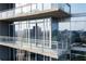 Balcony with glass railings offering city views and reflecting the skyline at 1065 Peachtree Ne St # 3504, Atlanta, GA 30309