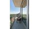 Balcony with outdoor seating and scenic city views, offering an ideal spot for relaxation and enjoying the cityscape at 1065 Peachtree Ne St # 3504, Atlanta, GA 30309