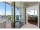 Luxury bathroom featuring a glass-enclosed shower, soaking tub, and stunning city views at 1065 Peachtree Ne St # 3504, Atlanta, GA 30309