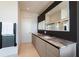 Elegant bathroom featuring a double vanity with marble countertops, sleek black fixtures, and a minimalist design at 1065 Peachtree Ne St # 3504, Atlanta, GA 30309