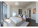 Bright bedroom features floor-to-ceiling windows with stunning views and a neutral color palette, creating a serene atmosphere at 1065 Peachtree Ne St # 3504, Atlanta, GA 30309