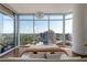 This bedroom boasts floor-to-ceiling windows that provide a breathtaking view of the city skyline at 1065 Peachtree Ne St # 3504, Atlanta, GA 30309