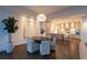 Open concept layout of dining room and kitchen area, offering hardwood floors and modern design at 1065 Peachtree Ne St # 3504, Atlanta, GA 30309