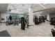 Modern gym with treadmills, weight machines, and a large window at 1065 Peachtree Ne St # 3504, Atlanta, GA 30309