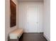 Entry hallway with hardwood flooring and a comfortable bench provides a welcoming entrance to the home's interior at 1065 Peachtree Ne St # 3504, Atlanta, GA 30309