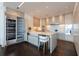 Eat-in kitchen with marble countertops, stainless appliances, wine cooler and custom cabinetry at 1065 Peachtree Ne St # 3504, Atlanta, GA 30309