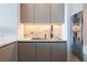 Contemporary kitchen showcasing a sink, stylish cabinets, and stainless steel appliances at 1065 Peachtree Ne St # 3504, Atlanta, GA 30309