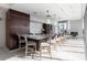 Bright kitchen featuring a large island with counter seating, modern lighting, and stainless steel appliances at 1065 Peachtree Ne St # 3504, Atlanta, GA 30309
