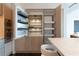 A modern, open kitchen with stainless steel appliances, wooden cabinets, and an island at 1065 Peachtree Ne St # 3504, Atlanta, GA 30309