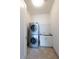 Convenient laundry room equipped with stacked washer and dryer, plus utility sink at 1065 Peachtree Ne St # 3504, Atlanta, GA 30309