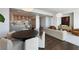 Open concept living space with eat-in kitchen and modern furnishings at 1065 Peachtree Ne St # 3504, Atlanta, GA 30309