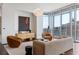 Bright and airy living room featuring modern furniture and expansive windows, perfect for relaxing and entertaining guests at 1065 Peachtree Ne St # 3504, Atlanta, GA 30309