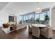 Open concept living room with floor-to-ceiling windows and contemporary decor, offering a stylish and comfortable space at 1065 Peachtree Ne St # 3504, Atlanta, GA 30309