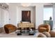 Cozy living room with stylish furnishings, a modern art piece and ample natural light for a relaxing atmosphere at 1065 Peachtree Ne St # 3504, Atlanta, GA 30309