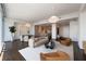 Bright open-concept living room featuring a dining area and stylish kitchen with modern appliances at 1065 Peachtree Ne St # 3504, Atlanta, GA 30309