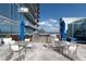 Rooftop outdoor kitchen with grills, dining tables, and comfortable seating at 1065 Peachtree Ne St # 3504, Atlanta, GA 30309