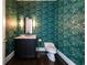 Chic powder room with designer wallpaper, modern fixtures, and vanity for a stylish and functional space at 1065 Peachtree Ne St # 3504, Atlanta, GA 30309