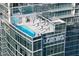 Luxurious rooftop pool and lounge area with umbrellas and city views at 1065 Peachtree Ne St # 3504, Atlanta, GA 30309